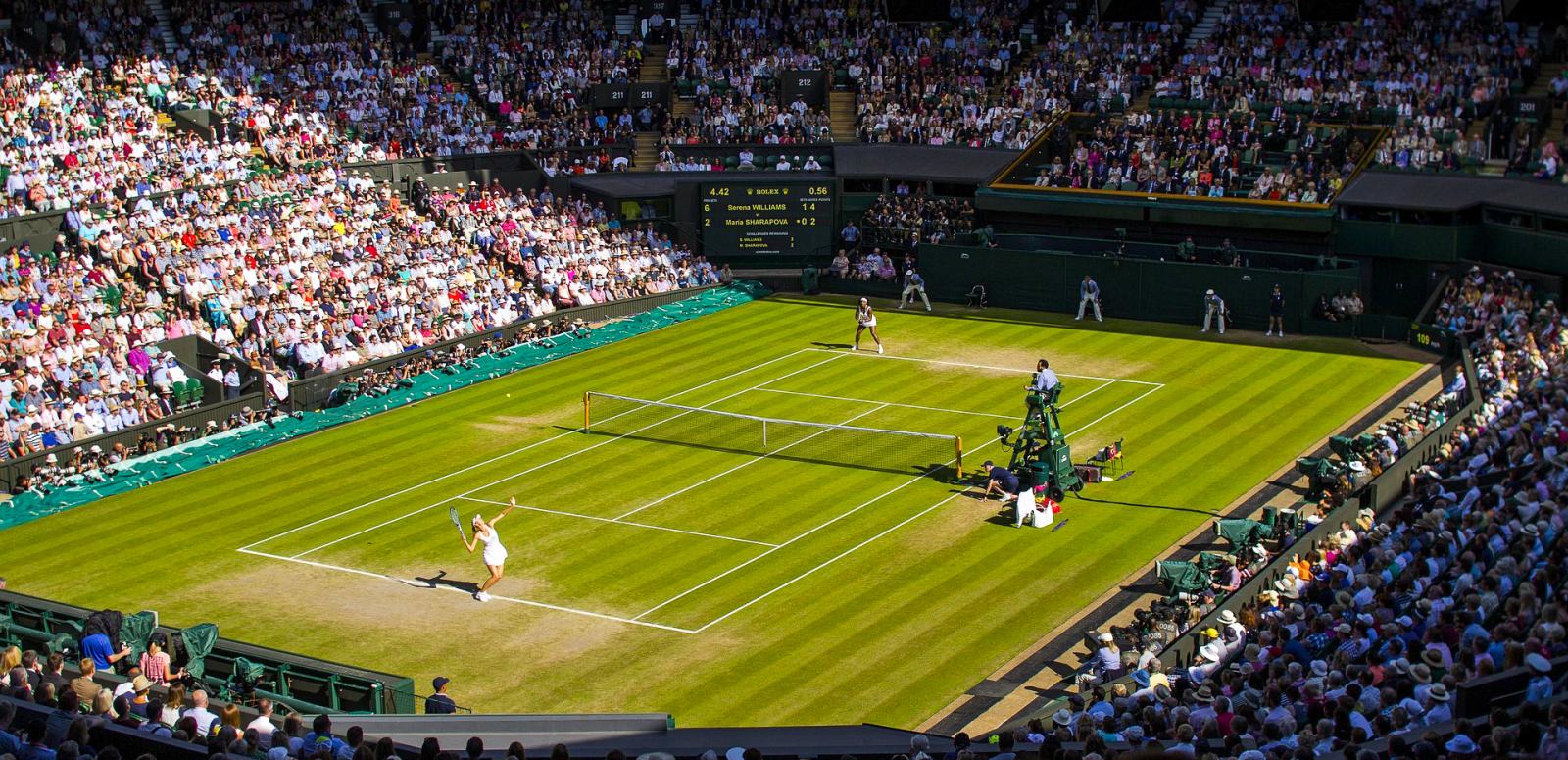 A tennis championship singles match taking place at Wimbledon