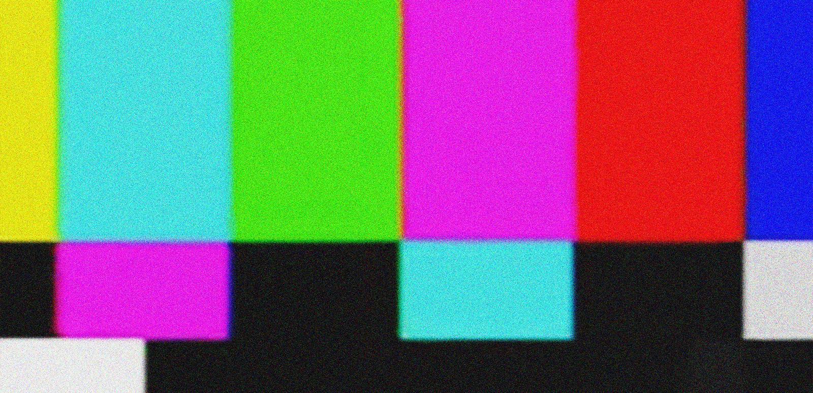 Brightly coloured vertical bars from a TV test pattern screen.