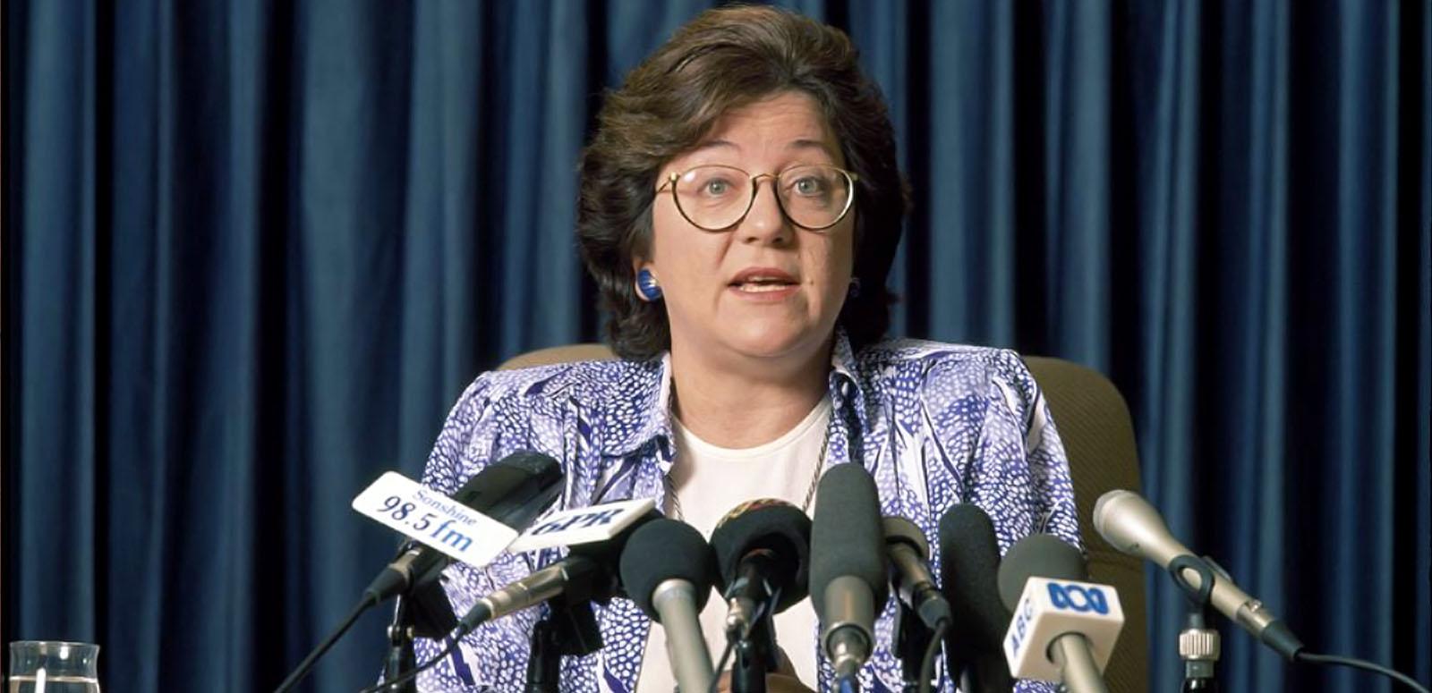 Dr Carmen Lawrence Politician Dr Carmen Lawrence talking at a press conference. She has many microphones in front of her.