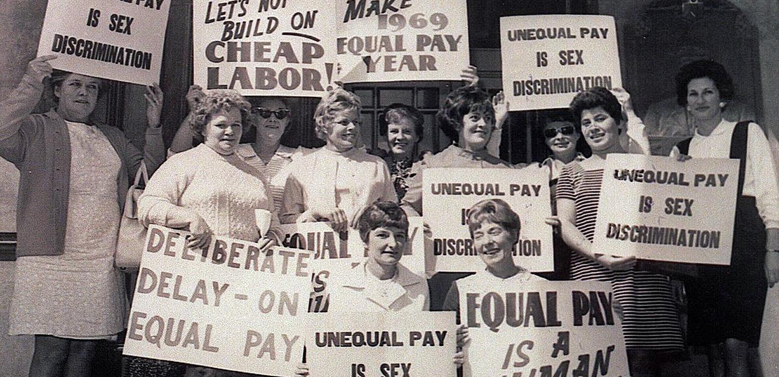 Women protest for equal pay A demonstration in the 1970s featuring a group of women holding posters and placards demanding equal pay.