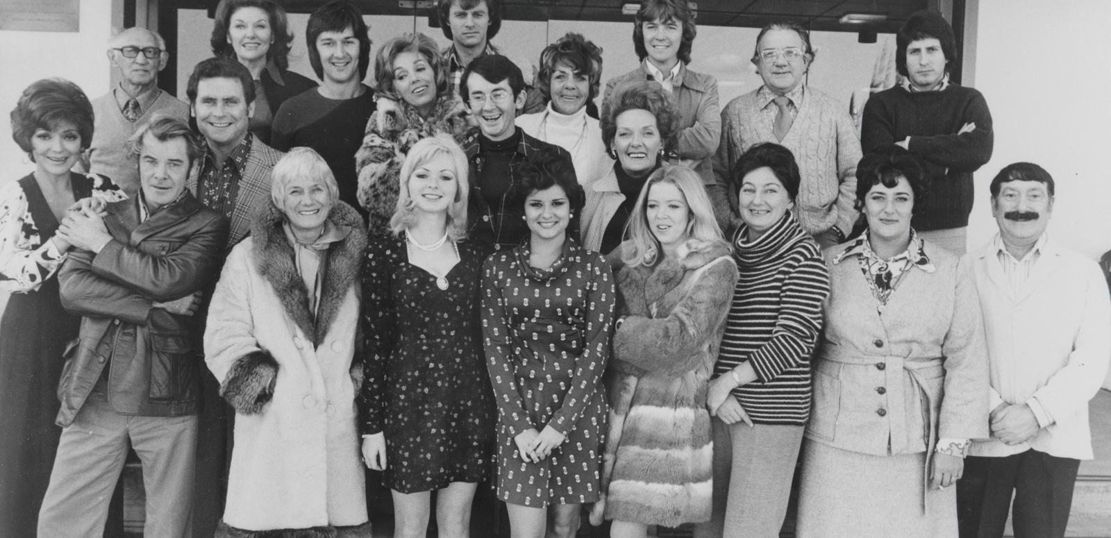 A group photograph of about 30 men and women, c1970s