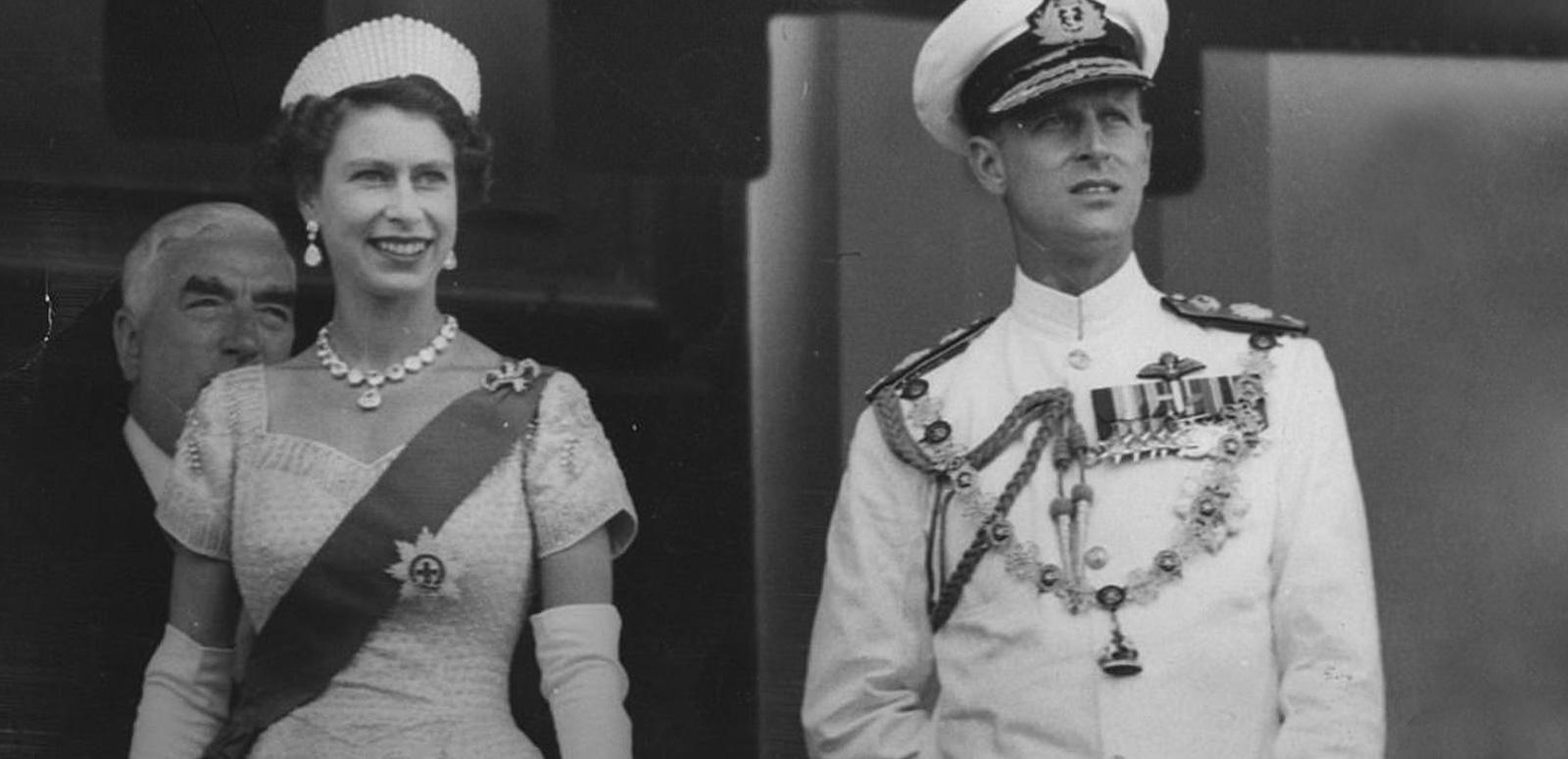 Queen Elizabeth II and Prince Philip in Australia. Sir Robert Menzies is standing behind them.
