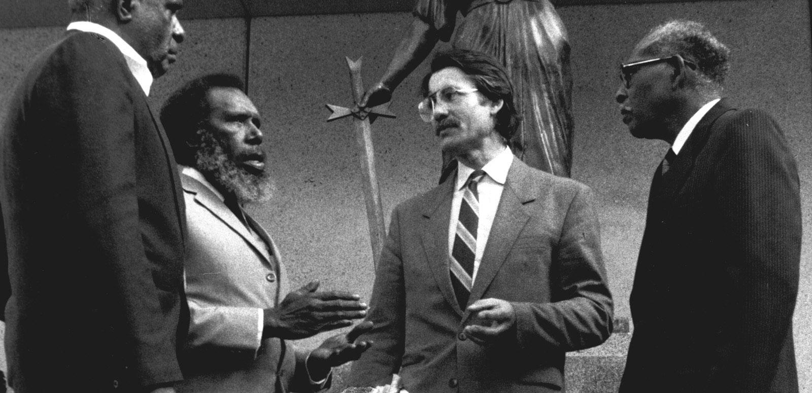 Eddie Mabo at the Queensland Supreme Court Eddie Mabo junior, Eddie Mabo and Greg McIntyre being interviewed on Murray Island. There is a boom in shot.