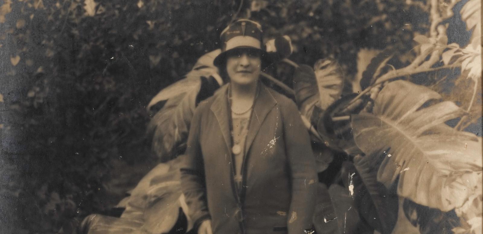 Sepia photograph of Dame Nellie Melba in a garden