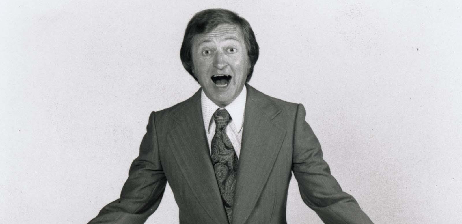 A 1970s publicity shot of Graham Kennedy wearing a suit and exclaiming at the camera. A 1970s publicity shot of Graham Kennedy wearing a suit and exclaiming at the camera.