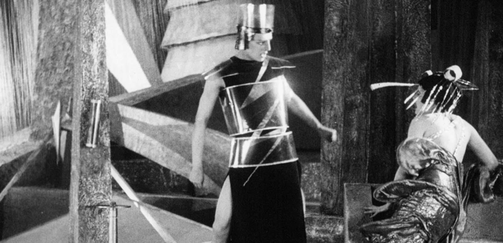 Two figures argue in a scene from the futuristic 1924 Russian science-fiction silent film Aelita, Queen of Mars Two figures argue in a scene from the futuristic 1924 Russian science-fiction silent film Aelita, Queen of Mars