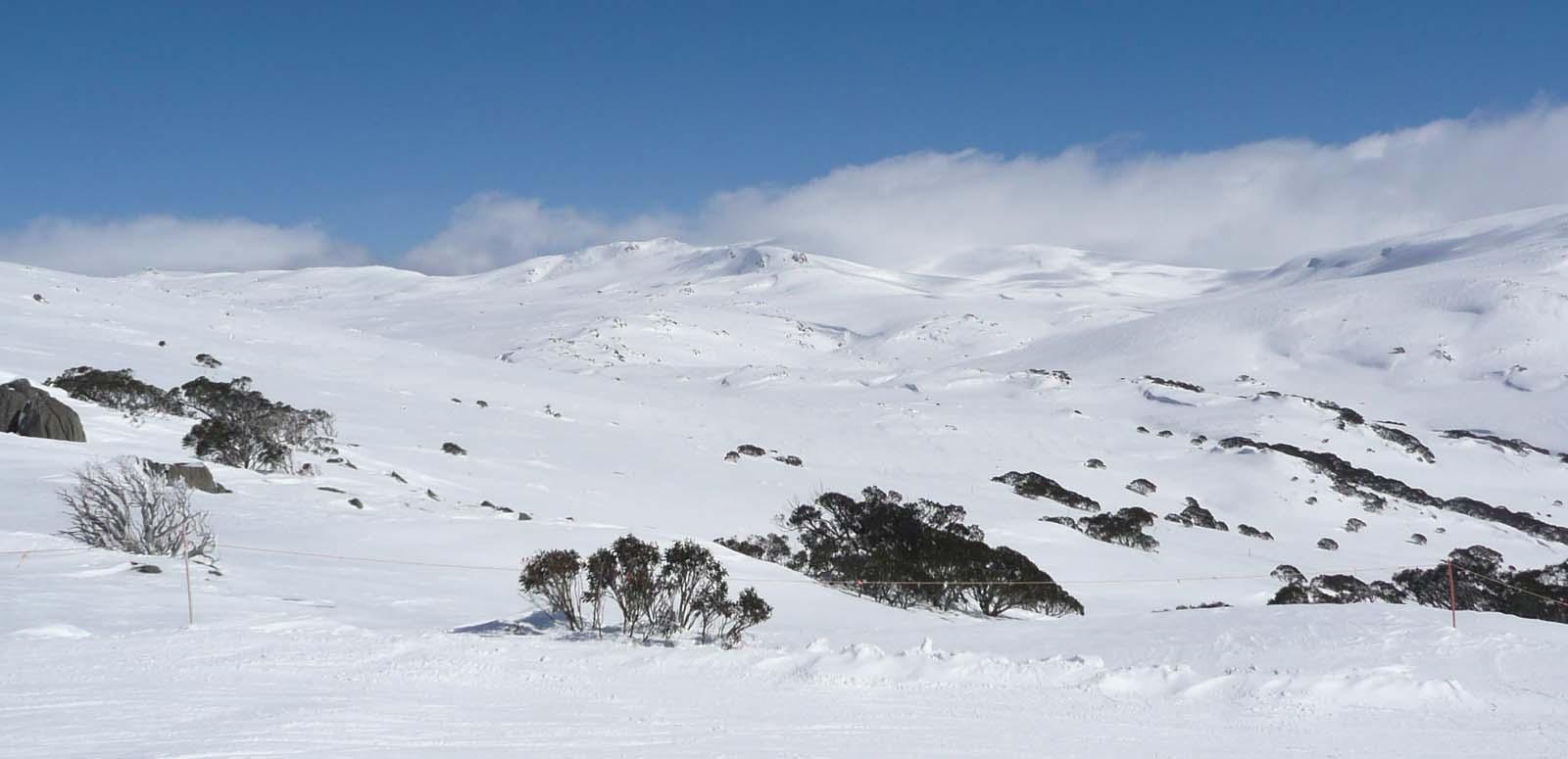 View of snow-covered mountain range towards Mount Kosciuszko in winter View of snow-covered mountain range towards Mount Kosciuszko in winter