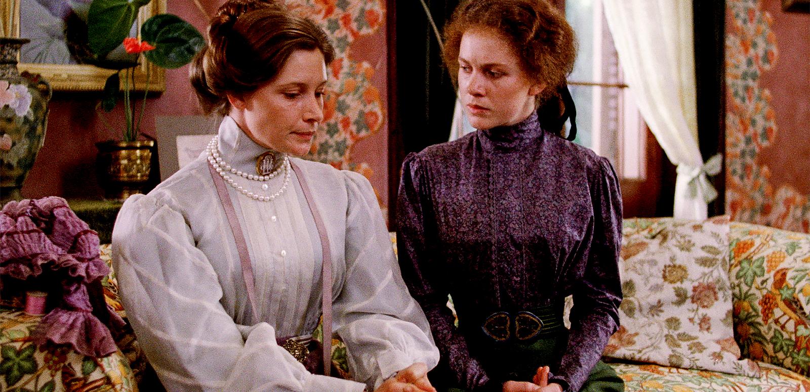 Wendy Hughes and Judy Davis seated on a couch talking in a still from My Brilliant Career Wendy Hughes and Judy Davis seated on a couch talking in a still from My Brilliant Career
