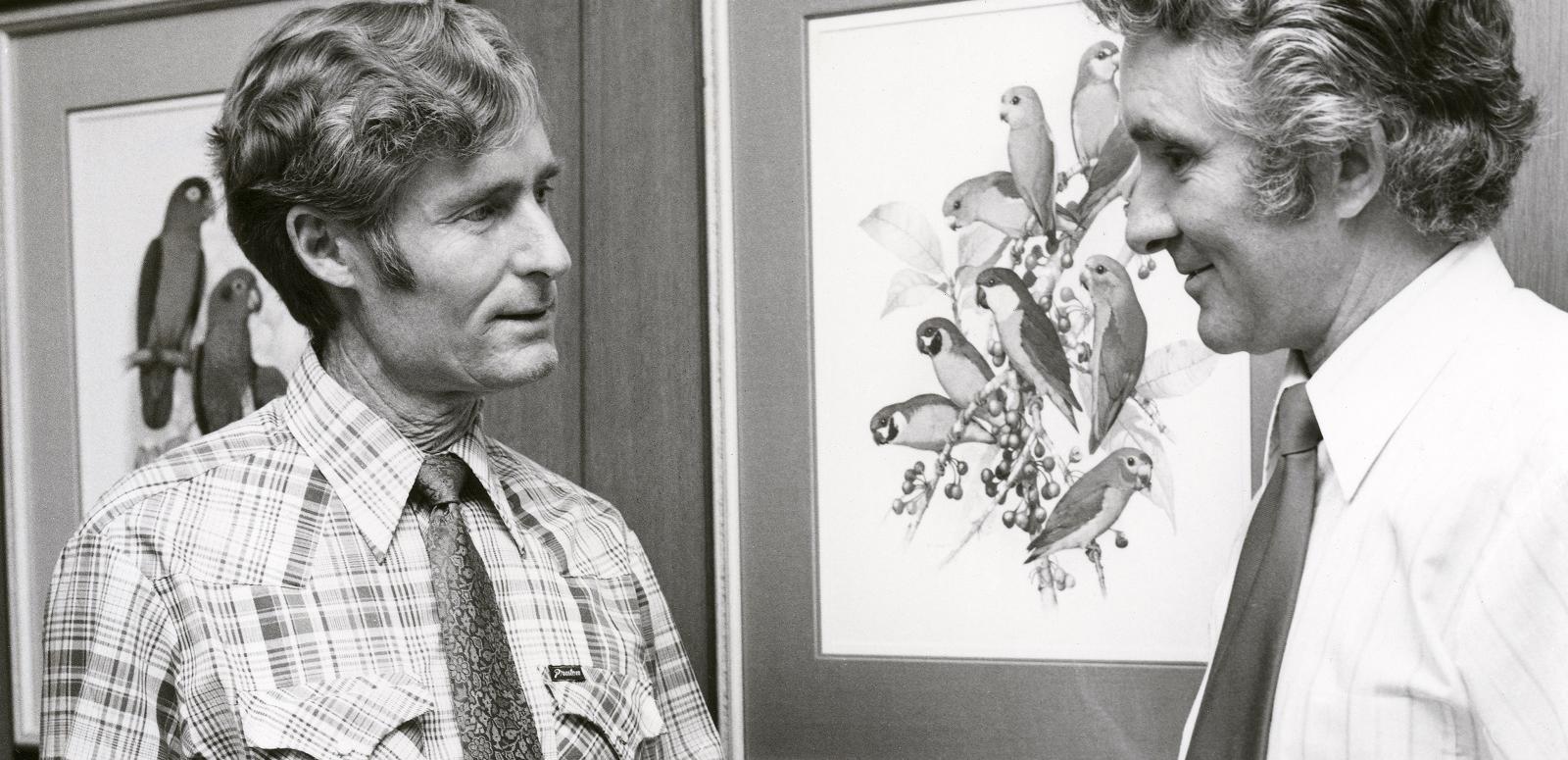 John Hutchinson hero image John Hutchinson with Peter Burgis of the National Library of Australia in 1980.