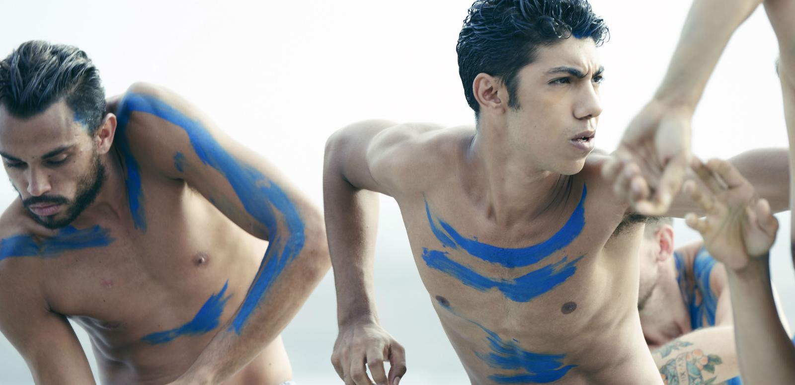 Production still from 'Spear' showing young Aboriginal men doing a traditional dance