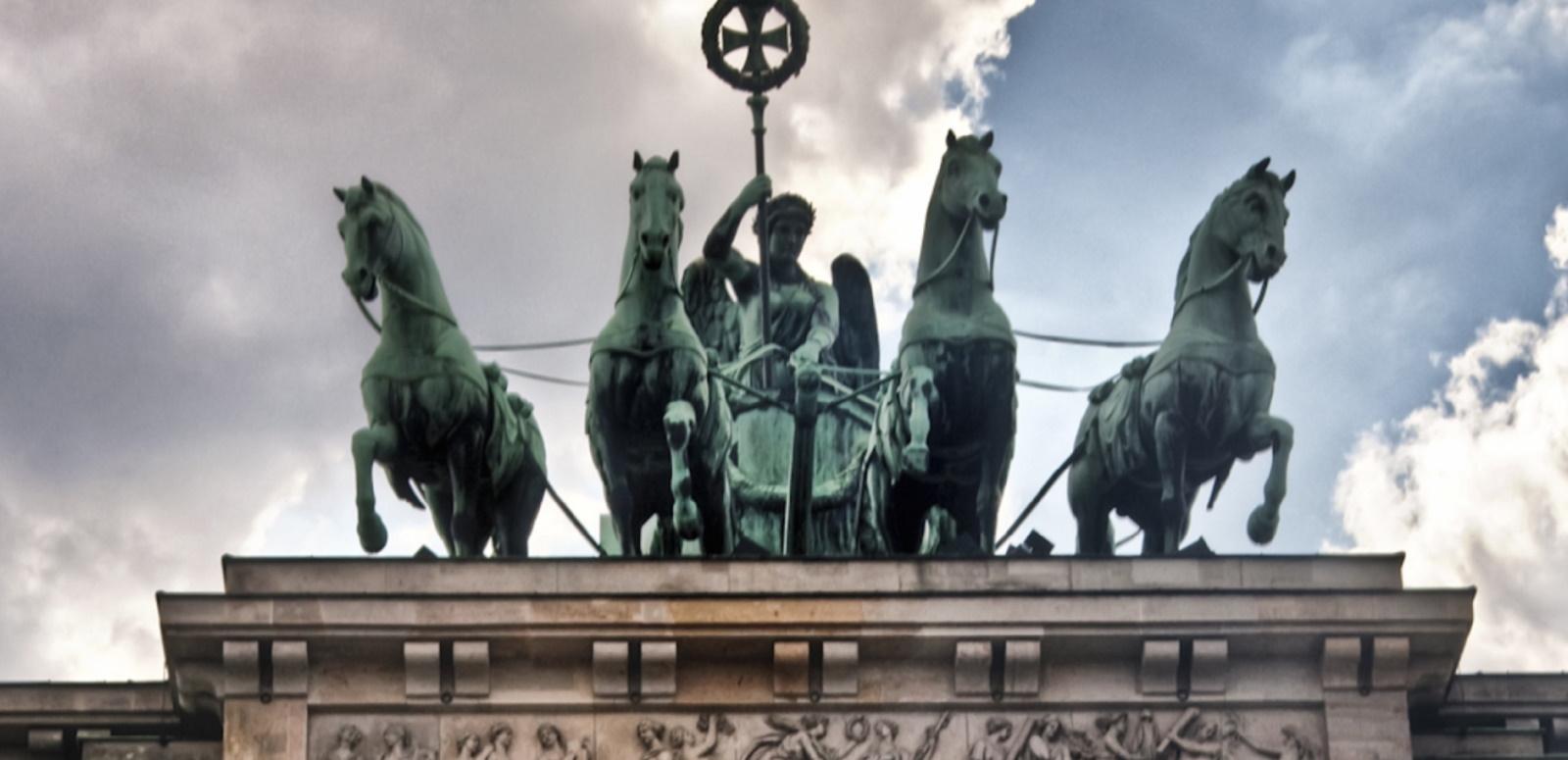 Bronze chariot rider and four horses atop the Brandenburg Gate Bronze chariot rider and four horses atop the Brandenburg Gate