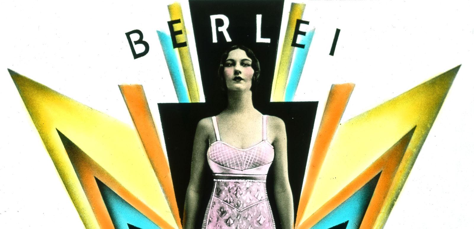 A woman wearing a pink foundation garment stands amidst art deco design elements suggesting power and lightening. A woman wearing a pink foundation garment stands amidst art deco design elements suggesting power and lightening.