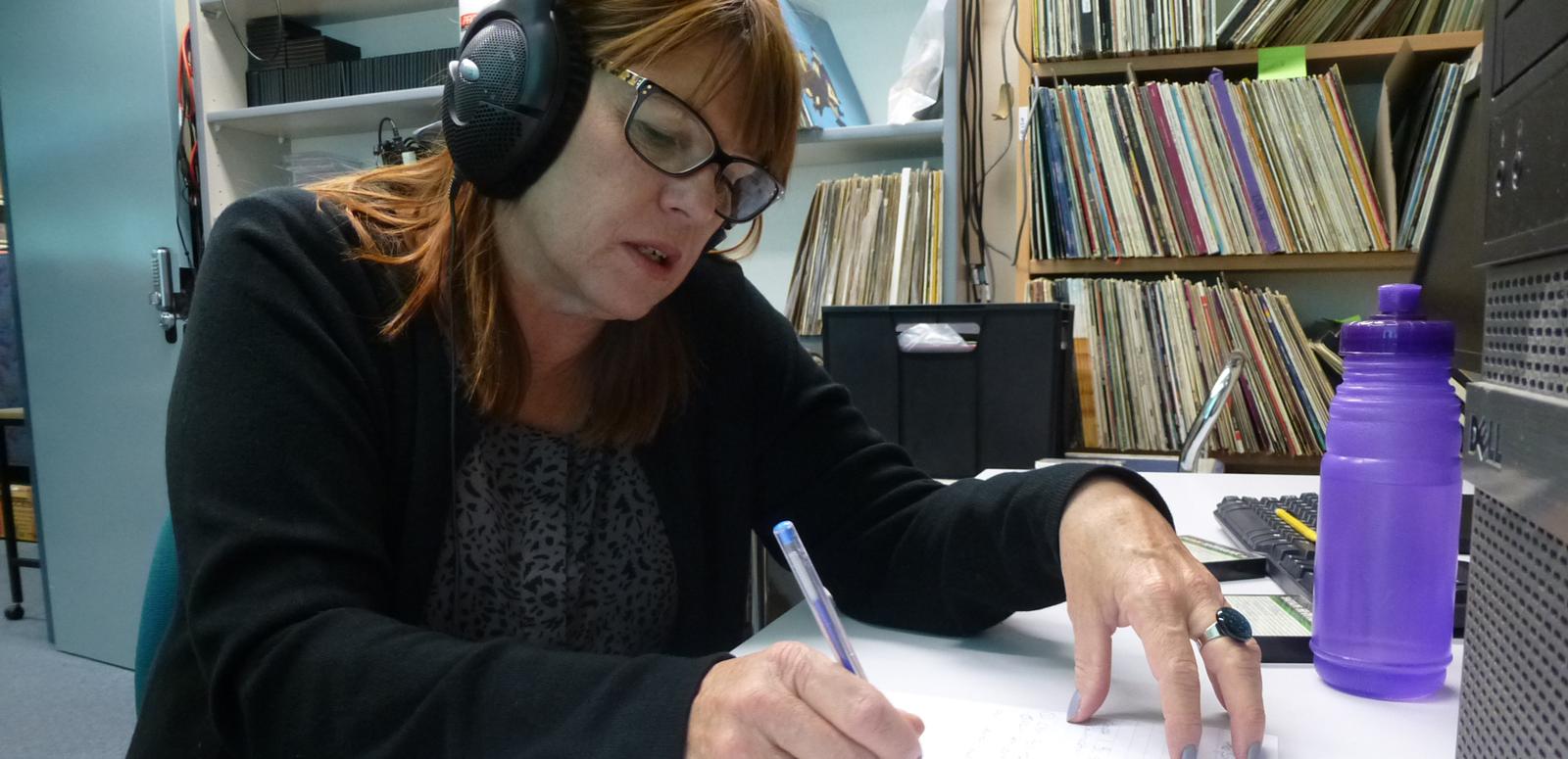 Karen Hewitt at her desk working at the NFSA