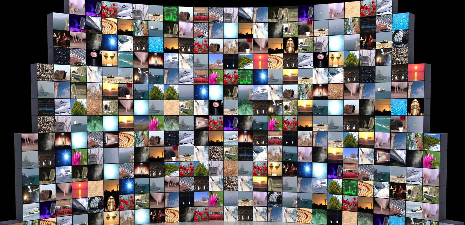 A bank of TV screens showing diverse colourful images