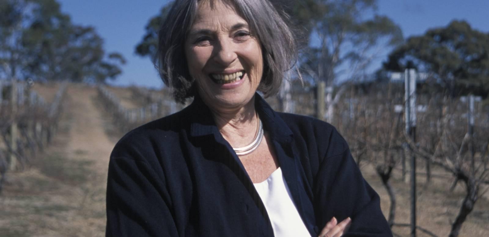 Betty Churcher standing outside, laughing