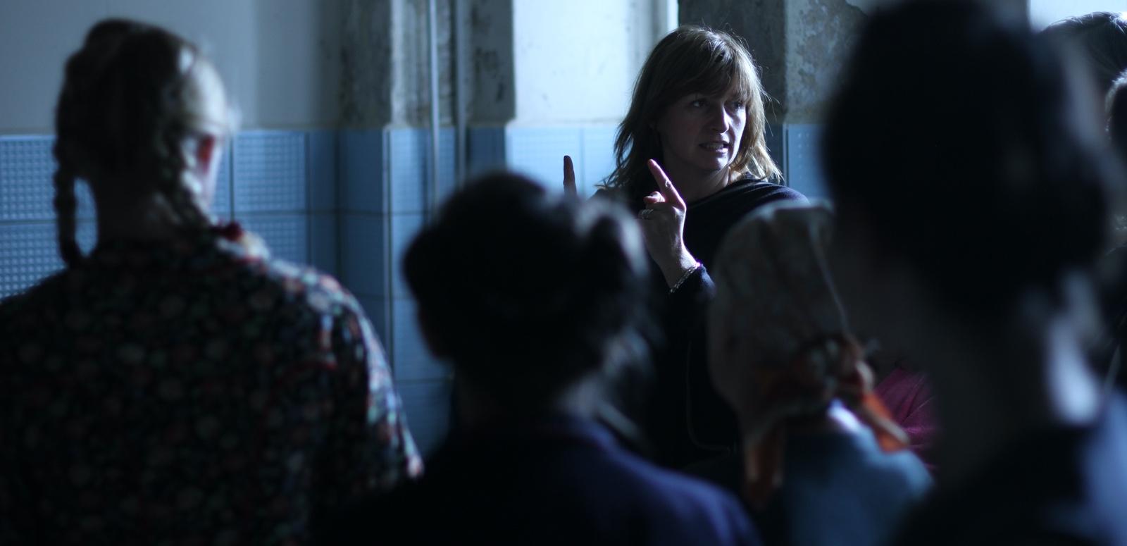 Cate Shortland curated collection Director Cate Shortland directs a room full of people. We see the other people from behind and out of focus.