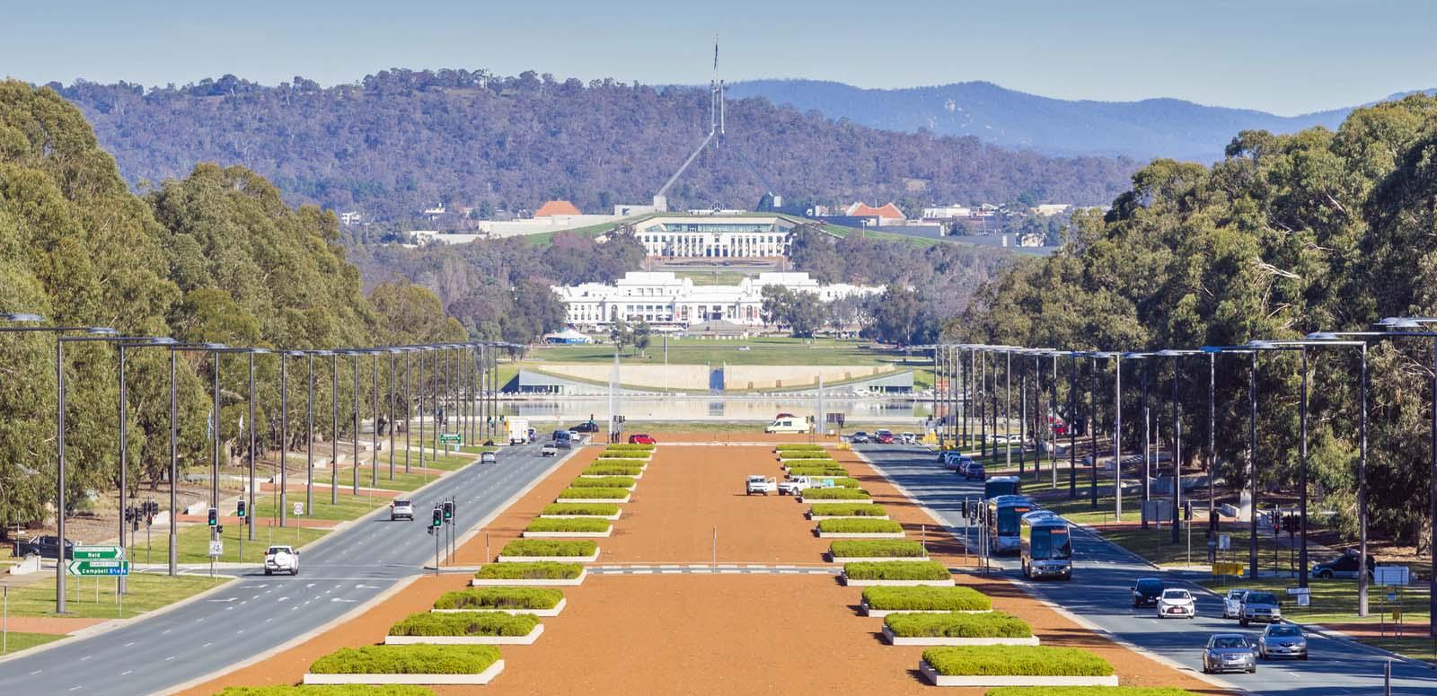 The old and new Parliament houses in Canberra seen down Anzac Avenue