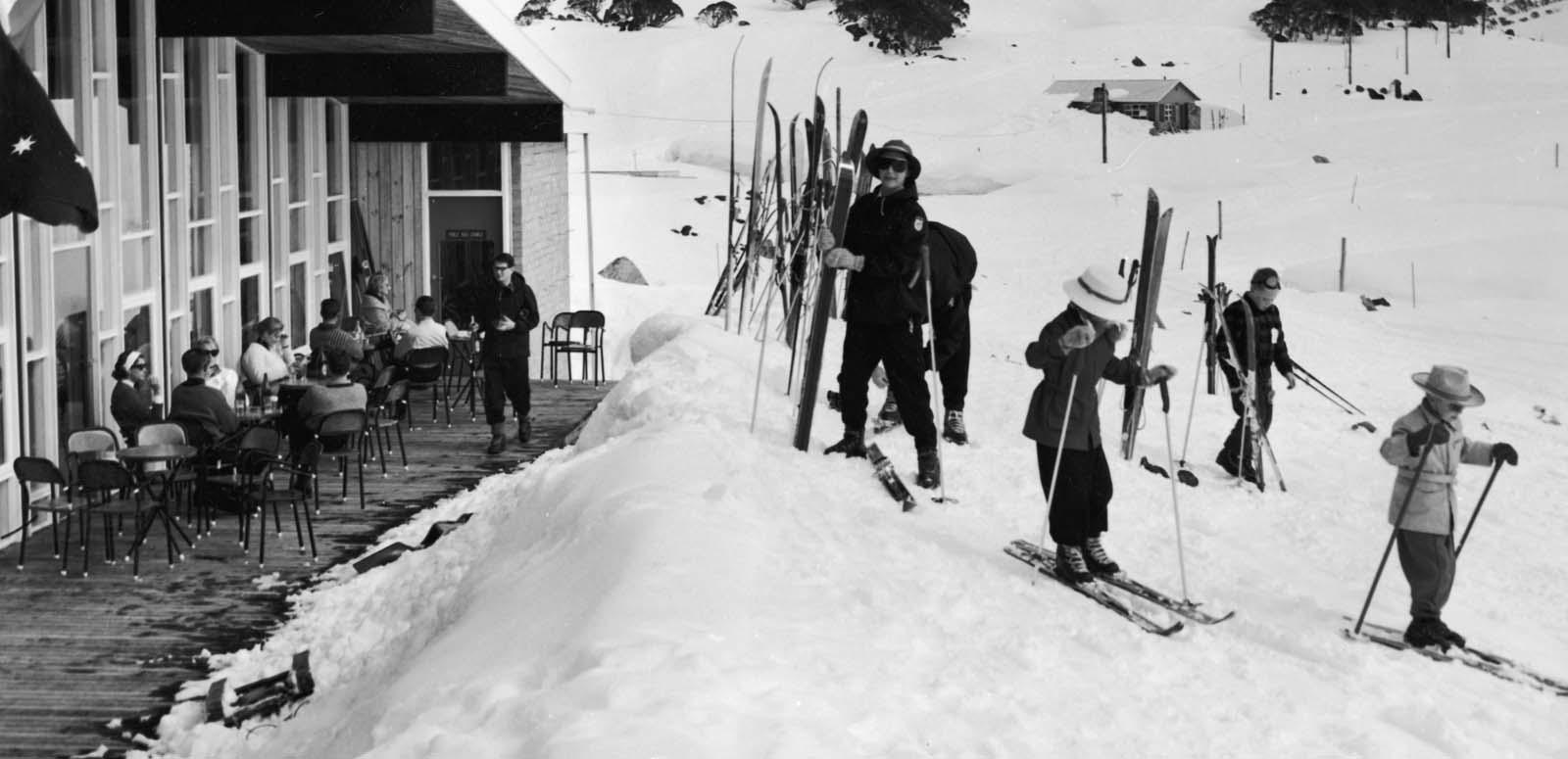 Skiers outside a ski lodge in 1961