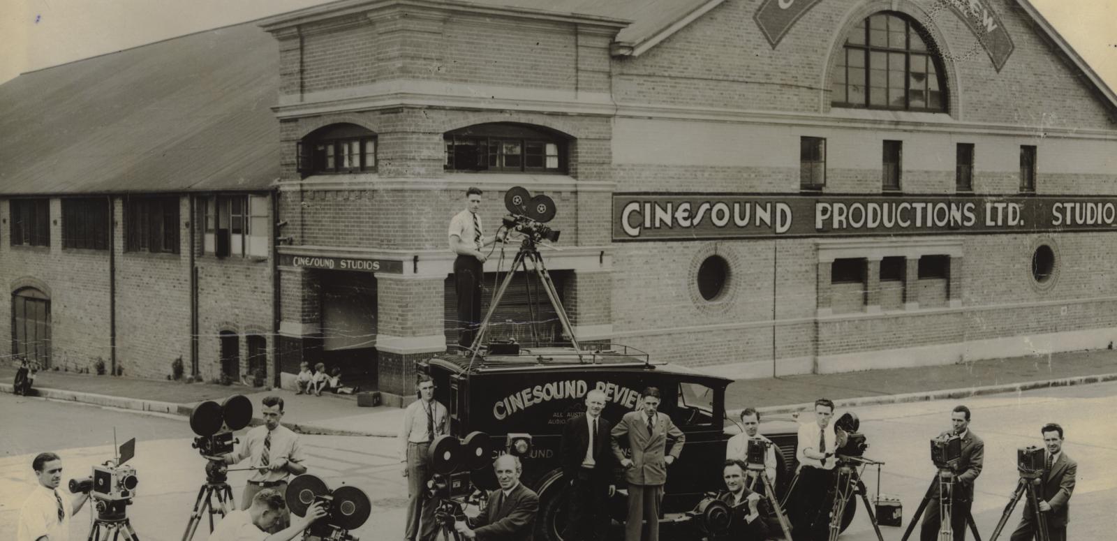 Cinesound Productions Studio Several cameramen pose outside the Cinesound productions studio with their cameras