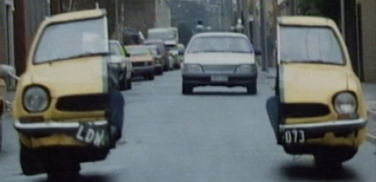 Malcolm hero image Malcolm's getaway car splits into two to avoid the police