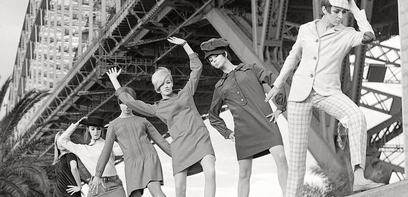 Groovers underneath the Sydney Harbour Bridge Black and white photo of six female models dressed in fashion from 1964 posing underneath the Sydney Harbour Bridge.