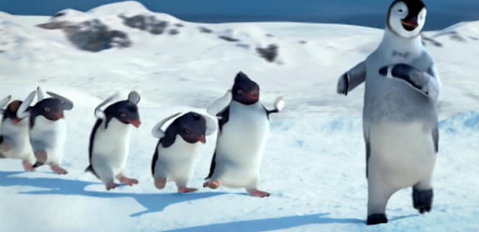 Mumble (Elijah Wood) leads a group of penguins dancing