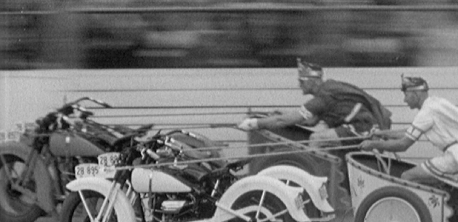 NSW Police Carnival 1936 Daredevil Chariots Two police officers in costume, riding their 'motorcycle chariots', Ben Hur style