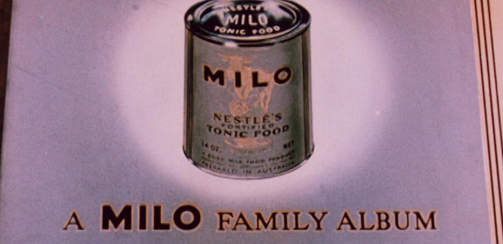 Still showing a milo tin with 'A Milo Family Album' underneath