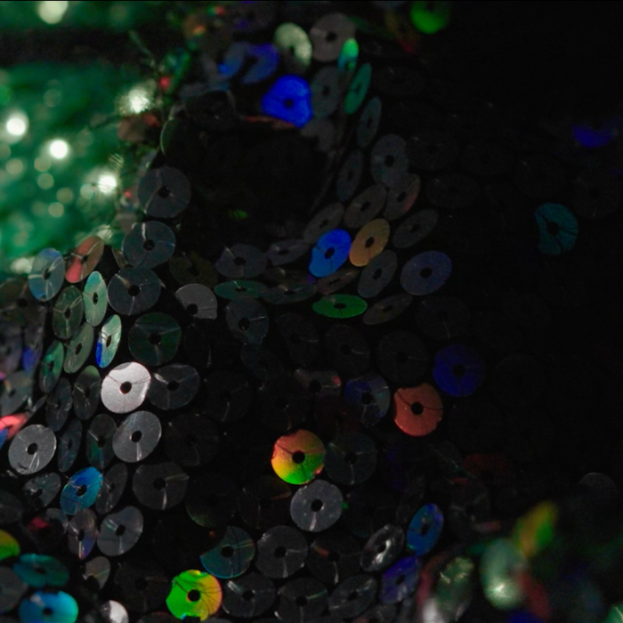 Close up of some sparkly sequinned fabric.