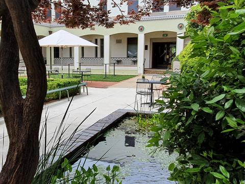 Courtyard with pond in the foreground