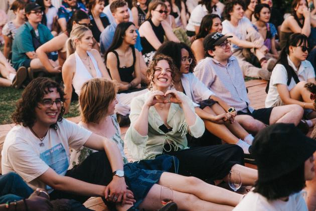 Crowd sitting and watching Nai Palm Live at the NFSA