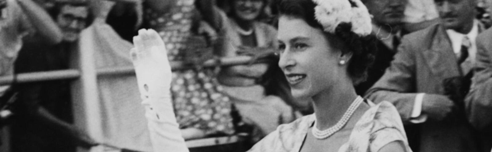 Queen Elizabeth II, c 1950s, waving from a car.