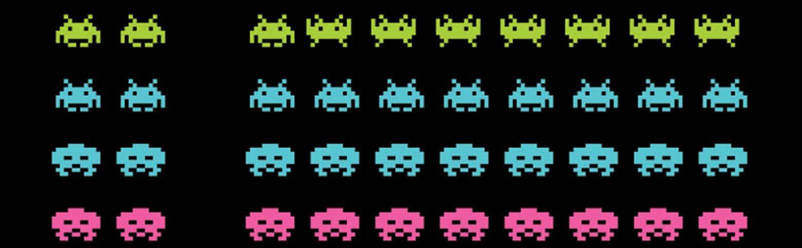 Rows of brightly-coloured, small, alien-like characters on a black computer screen from a 'space-invaders'-style video game, probably from the 1980s.