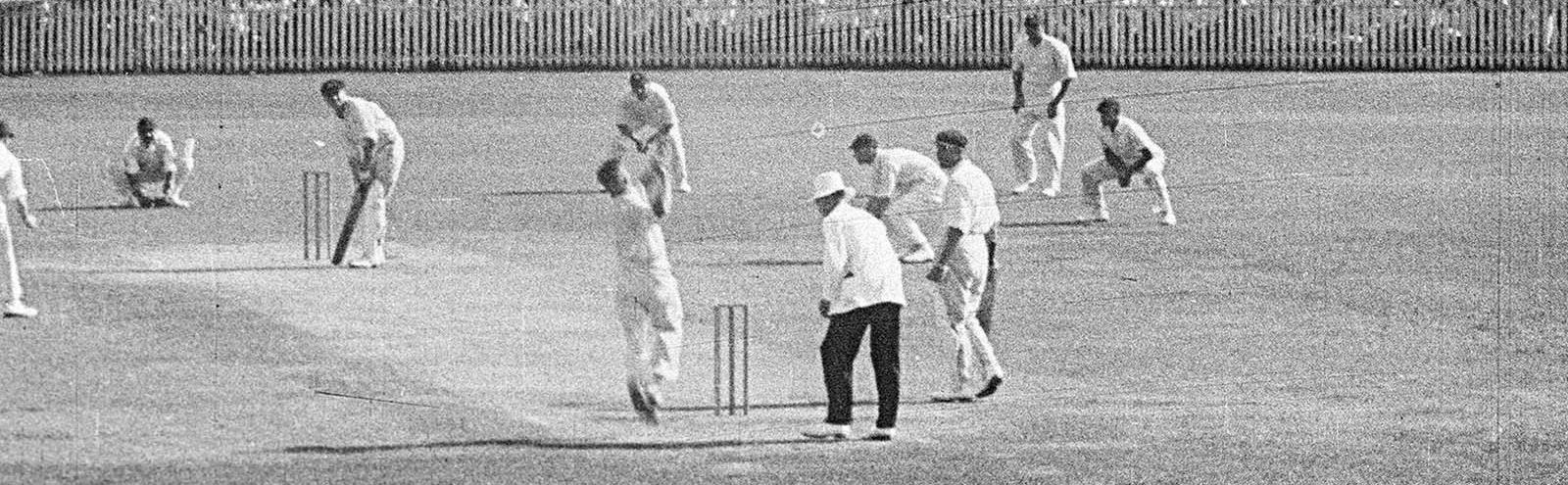 Cricket players and an umpire on the Sydney Cricket Ground playing cricket in 1933.