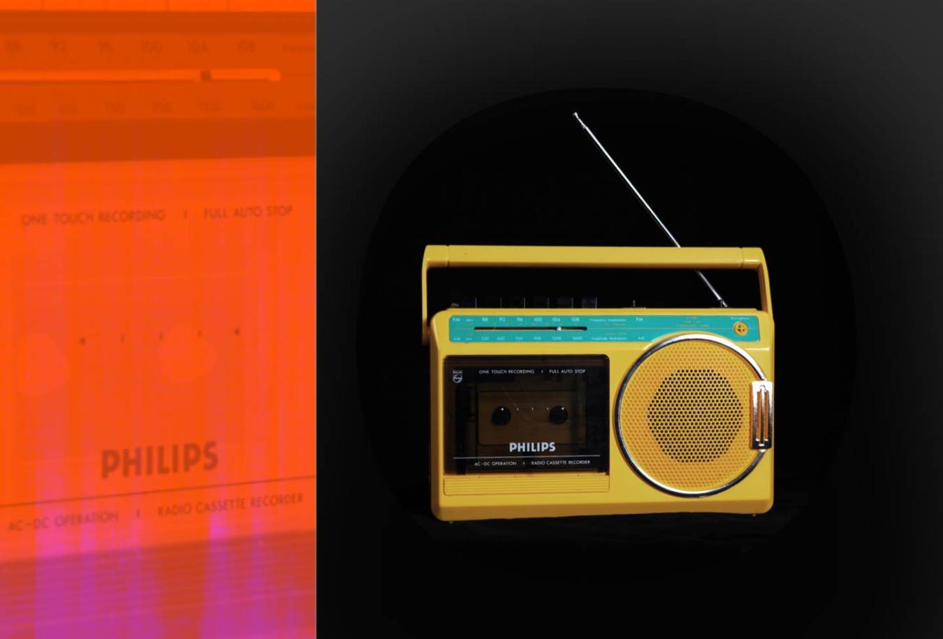 A bright yellow portable radio and cassette player