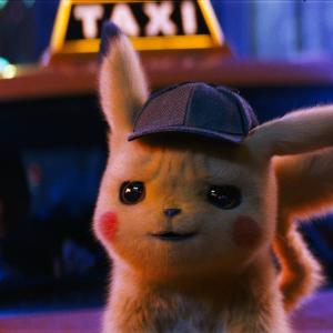 The small furry-blonde video game character Pikachu with rosy cheeks and wearing a Sherlock Holmes detective cap sitting on the bonnet of a taxi