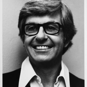 Head and shoulders publicity shot of broadcaster Bob Rogers.