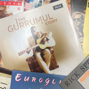 A selection of album covers featuring Australian recording artists including Gurrumul, Rick Springfield, Eurogliders, Colleen Hewett, Geraldine Turner and Paul Kelly