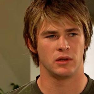 Chris Hemsworth looking uncertain in a scene from Home and Away