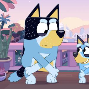 Animated still of two blue heeler dogs dancing in the twilight on a balcony.