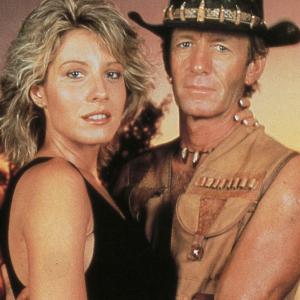 Paul Hogan as Mick Dundee and Linda Kozlowski as Sue Charlton in a cocktail party scene from Crocodile Dundee