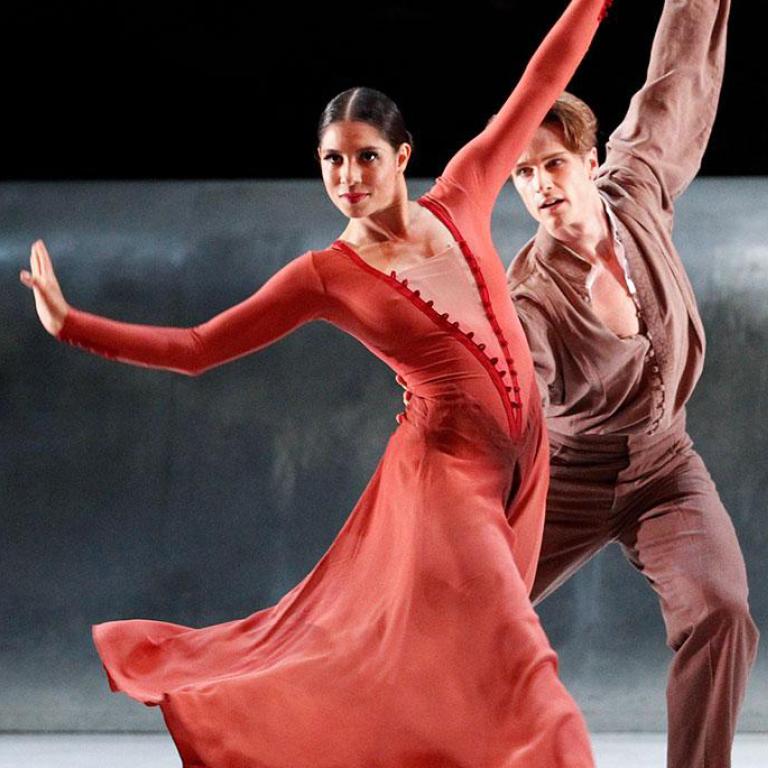 First Nations dancer Ella Havelka performing on stage with a male dancer.