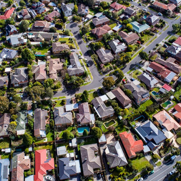 Aerial shot of houses in the outer suburbs of Melbourne.