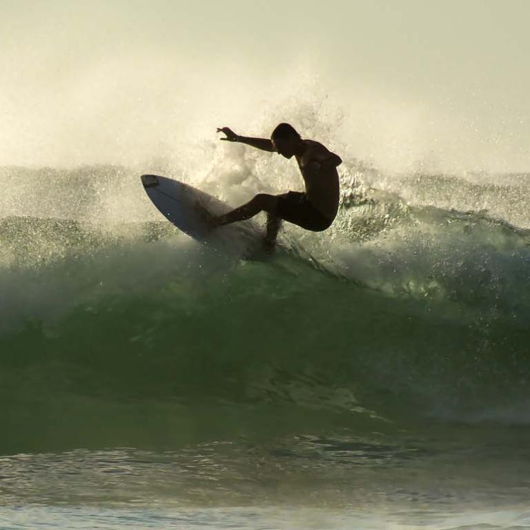 Young surfer surfing at Bondi Beach