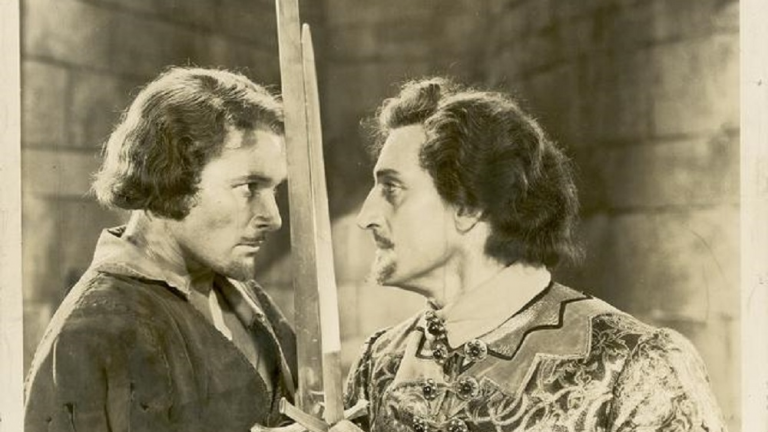 The Adventures of Robin Hood_Errol Flynn glares at Basil Rathbone Errol Flynn glares at Basil Rathbone