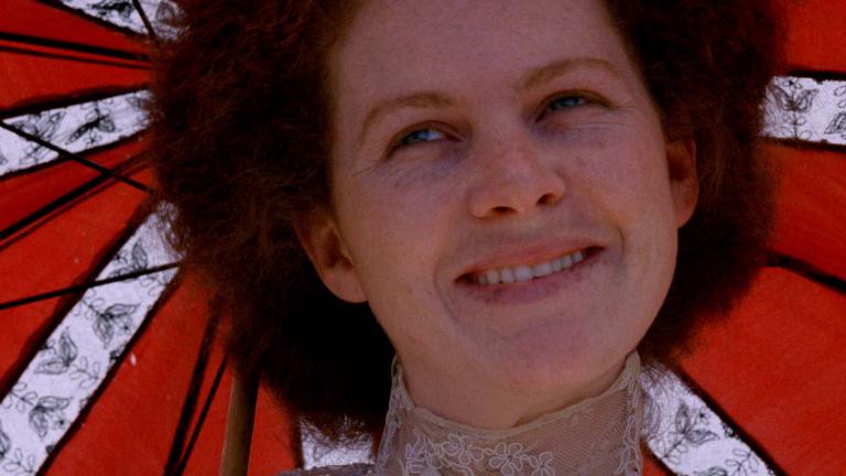 A close-up of Judy Davis smiling under a parasol in My Brilliant Career A close-up of Judy Davis smiling under a parasol in My Brilliant Career