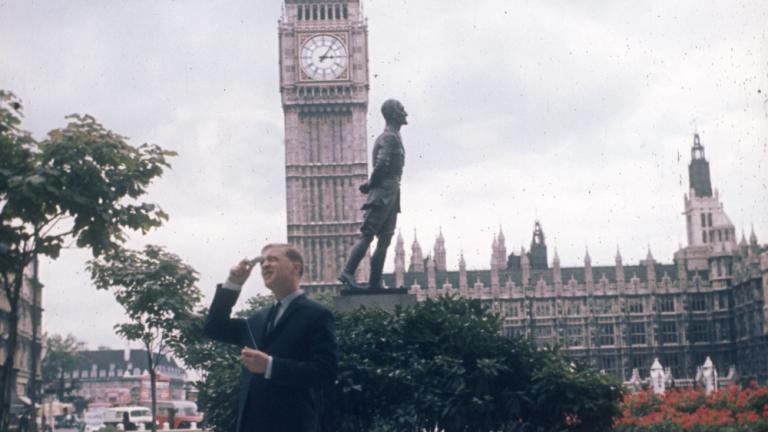 Graham Kennedy taking photos in Parliament Square, London. Big Ben, Westminster Hall and the statue of Field Marshal Jan Christiaan Smuts in the background