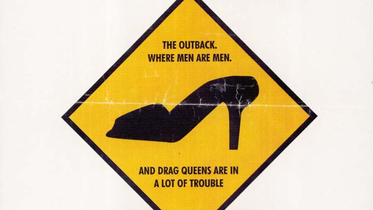Daybill teaser poster: The Adventures of Priscilla, Queen of the Desert Title at top in black text. Underneath silhouette of a stiletto on a yellow background similar to a roadsign. Text reads 'The outback. Where men are men. And drag queens are in a lot of trouble'. Release date in yellow box at bottom.