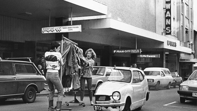 One half of the getaway car surprises two shop assistants