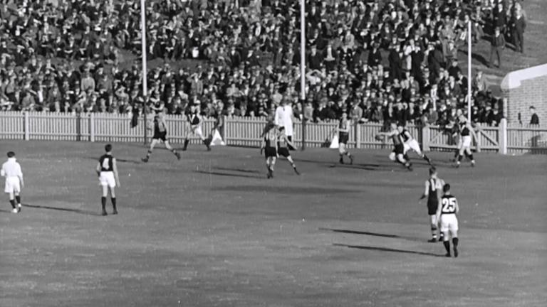 Furler kicking a goal in an AFL match